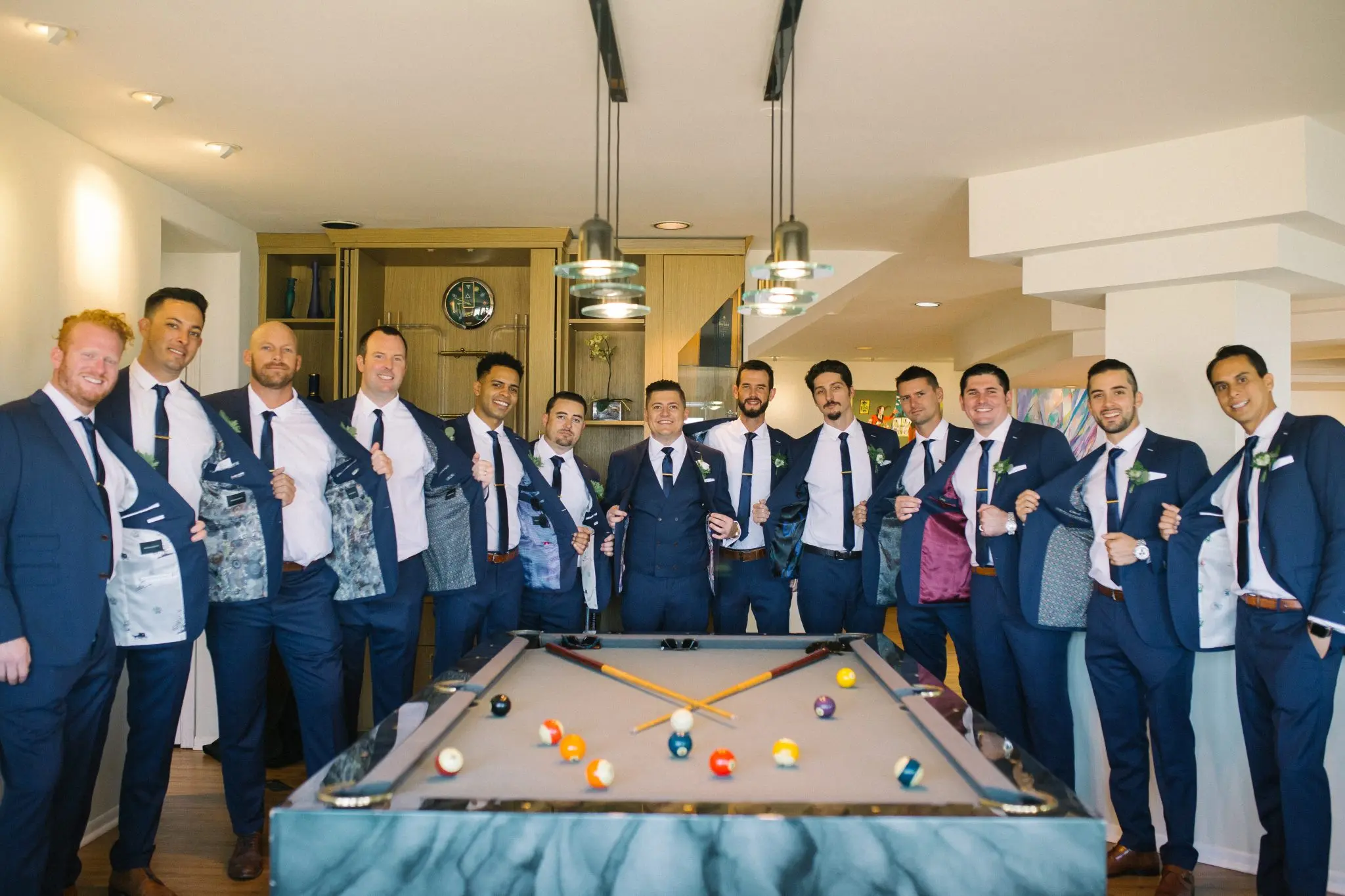 Groomsmen fitted in custom suits at The Grotto